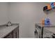 Functional laundry room with washer, dryer, and granite countertop at 11718 Preservation Ln, Charlotte, NC 28278