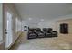 Bright, open living room with plenty of natural light and comfortable reclining seating at 11718 Preservation Ln, Charlotte, NC 28278