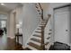 Classic staircase with wood treads and white risers, adding charm and elegance to the home's interior at 11718 Preservation Ln, Charlotte, NC 28278