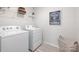 A bright laundry room with new machines, wire basket, and ample shelving at 12012 Zazu Way, Charlotte, NC 28215