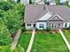 Aerial shot showcases the landscaped front yard and attractive exterior of this well-manicured home at 13421 Copley Square Dr, Huntersville, NC 28078