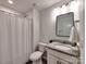 Clean bathroom featuring a vanity with granite countertop, modern fixtures, and a shower with tub combo at 13421 Copley Square Dr, Huntersville, NC 28078