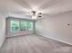 Bright bonus room with plush carpeting, and an abundance of natural light at 13421 Copley Square Dr, Huntersville, NC 28078