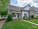 Charming home featuring manicured lawn, sidewalk, and inviting front entrance at 13421 Copley Square Dr, Huntersville, NC 28078