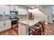 Modern kitchen featuring stainless steel appliances, ample countertop space and a center island at 13421 Copley Square Dr, Huntersville, NC 28078