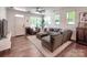 Bright living room featuring recessed lighting, hardwood flooring, and open floor plan at 13421 Copley Square Dr, Huntersville, NC 28078