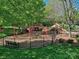 Well-maintained community playground features swings, slides, and play structures in a safe and fenced environment at 13421 Copley Square Dr, Huntersville, NC 28078