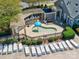 Community pool with lounge chairs and a covered picnic area at 13421 Copley Square Dr, Huntersville, NC 28078