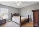 Bedroom featuring a traditional wood bed set, neutral colored walls, carpet, and a single window at 1457 Matthew Allen Cir, Kannapolis, NC 28081