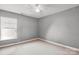 Gray bedroom featuring carpet, neutral colored walls, and a single window providing ample natural light at 1457 Matthew Allen Cir, Kannapolis, NC 28081
