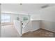 Upstairs hallway featuring neutral carpet and abundant natural light at 1457 Matthew Allen Cir, Kannapolis, NC 28081