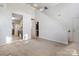 Open concept living room featuring tall ceilings and easy access to the kitchen and entry areas at 1457 Matthew Allen Cir, Kannapolis, NC 28081