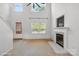 Bright and airy living room with fireplace and large window with plenty of natural light at 1457 Matthew Allen Cir, Kannapolis, NC 28081