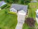 Well-maintained home with lush landscaping, extended drive, and two-car garage at 1505 Moss Springs Rd, Albemarle, NC 28001