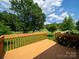 Relaxing wood deck overlooking the beautifully landscaped backyard of the property at 1505 Moss Springs Rd, Albemarle, NC 28001