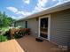 Cozy wooden deck, adorned with flowering shrubs, ideal for enjoying the outdoors at 1505 Moss Springs Rd, Albemarle, NC 28001