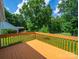 Spacious wooden deck, perfect for outdoor dining with a view of the backyard at 1505 Moss Springs Rd, Albemarle, NC 28001