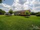 Expansive backyard featuring a lovely patio and lush lawn, ideal for outdoor gatherings at 1505 Moss Springs Rd, Albemarle, NC 28001