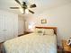 Bedroom featuring a bed, hardwood floors, a ceiling fan, and a window with curtains at 1505 Moss Springs Rd, Albemarle, NC 28001