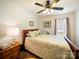 Bedroom featuring hardwood floors, a ceiling fan, and a window with curtains at 1505 Moss Springs Rd, Albemarle, NC 28001