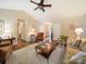 Bright living room featuring vaulted ceilings, ceiling fan, neutral carpet, and views of the entryway and hallway at 1505 Moss Springs Rd, Albemarle, NC 28001
