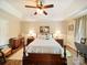 Comfortable main bedroom featuring a ceiling fan, wood-look flooring, and neutral paint at 1505 Moss Springs Rd, Albemarle, NC 28001