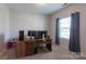 Bright bedroom featuring soft carpet, curtains, and plenty of space for a home office setup at 177 Willow Valley Dr, Mooresville, NC 28115