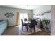 Bright dining room with modern lighting, a sliding glass door, and stylish decor, perfect for Gathering gatherings at 177 Willow Valley Dr, Mooresville, NC 28115