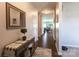 Inviting entryway with wood floors, stylish console table, mirror, and seamless transition to the living spaces at 177 Willow Valley Dr, Mooresville, NC 28115