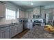 Modern kitchen featuring granite countertops, stainless steel appliances, and ample cabinet space at 177 Willow Valley Dr, Mooresville, NC 28115