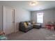 Cozy playroom with a gray sectional sofa, a small window, and ' kitchen set at 177 Willow Valley Dr, Mooresville, NC 28115