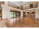Open concept living room with a view of the pool and access to the kitchen at 1822 Irby Rd, Monroe, NC 28112
