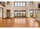 Spacious living room with ample natural light, stone fireplace and wood trim at 1822 Irby Rd, Monroe, NC 28112