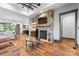 Living room boasting a stone fireplace, beamed ceilings, and hardwood floors at 1822 Irby Rd, Monroe, NC 28112