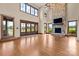 Grand living room featuring a stone fireplace, high ceilings, and a chandelier at 1822 Irby Rd, Monroe, NC 28112