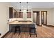 Basement wet bar offers seating, lighting, a sink, and built-in cabinets for entertaining at 1822 Irby Rd, Monroe, NC 28112