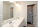 Bathroom features a dual sink vanity, large mirror, modern lighting, and a separate shower area at 1914 Loggerhead Dr, Lancaster, SC 29720
