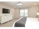 Bright bedroom featuring a television and natural lighting streaming through the windows at 1914 Loggerhead Dr, Lancaster, SC 29720