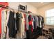 Walk-in closet features upper shelving, hanging rods, storage, and a window for ample natural light at 1914 Loggerhead Dr, Lancaster, SC 29720