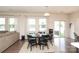 Dining area featuring a dark wood table set with chairs and natural light at 1914 Loggerhead Dr, Lancaster, SC 29720