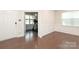 Bright exercise room features wainscoting, wood floors, and lots of natural light at 1914 Loggerhead Dr, Lancaster, SC 29720
