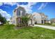 Charming two-story home with well-manicured lawn, stone accents, and an attached garage at 1914 Loggerhead Dr, Lancaster, SC 29720