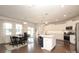 Spacious kitchen features a large island, modern appliances, and a dining area with natural light at 1914 Loggerhead Dr, Lancaster, SC 29720