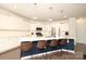 Modern kitchen featuring a large island with seating, pendant lighting and stainless steel appliances at 1914 Loggerhead Dr, Lancaster, SC 29720