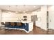 Bright kitchen featuring a large island with seating, stainless steel appliances, and plenty of cabinet space at 1914 Loggerhead Dr, Lancaster, SC 29720