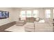 Open living room with plush sectional sofa, pillows, and wall-mounted TV at 1914 Loggerhead Dr, Lancaster, SC 29720