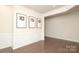 Bright living area features wainscoting, wood floors, and Gathering photos at 1914 Loggerhead Dr, Lancaster, SC 29720