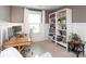 Bright office with gray walls, crisp white trim, modern desk and bookcase filled with books at 1914 Loggerhead Dr, Lancaster, SC 29720