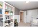 Office features gray walls, white trim, bookcase, a nearby doorway, and closet at 1914 Loggerhead Dr, Lancaster, SC 29720