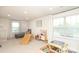 This large playroom includes a play kitchen, slide, seating area, and lots of natural light at 1914 Loggerhead Dr, Lancaster, SC 29720